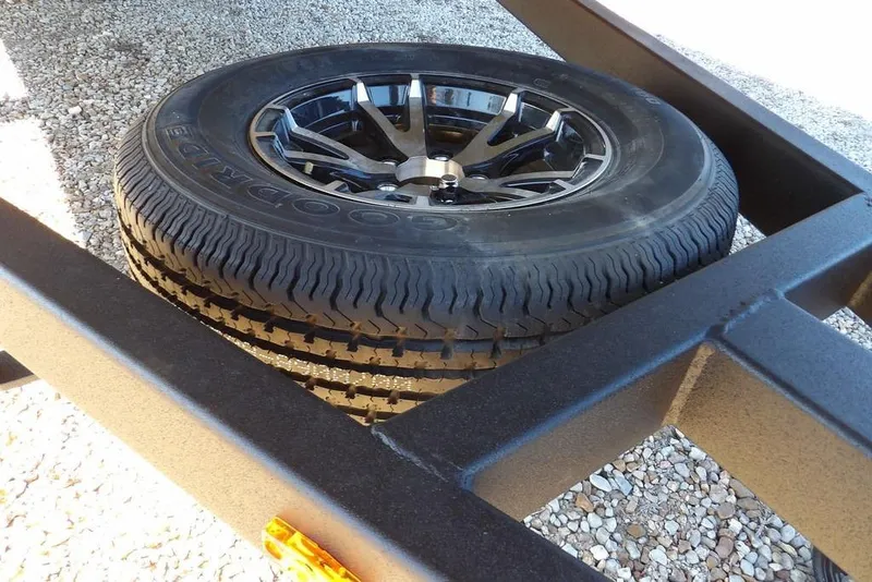 Slide: The Image of Spare tire on a 2026 Crestliner 2070 Retriever SCHD trailer, featuring Goodyear branding. - 36