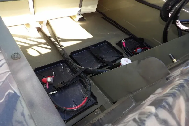 Slide: The Image of Interior view of 2026 Crestliner 2070 Retriever SCHD boat showing battery compartments and wiring. - 40