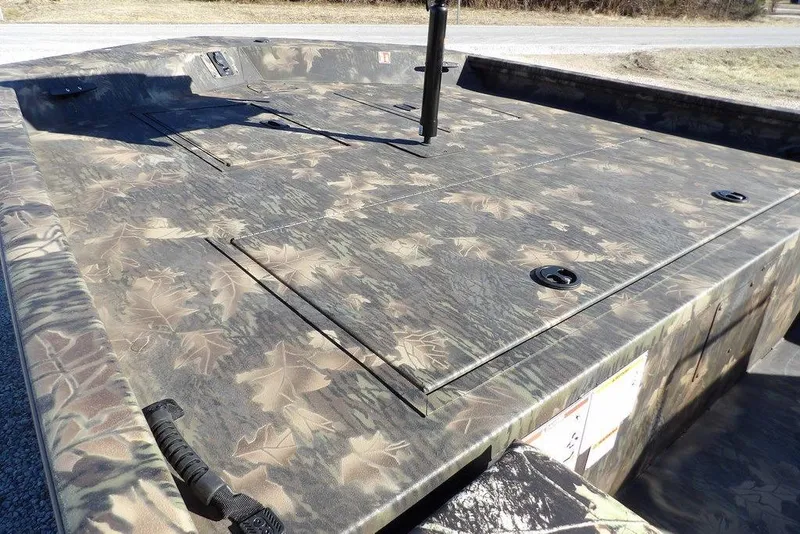 Slide: The Image of 2026 Crestliner 2070 Retriever SCHD boat with camouflage design, featuring a spacious deck. - 5