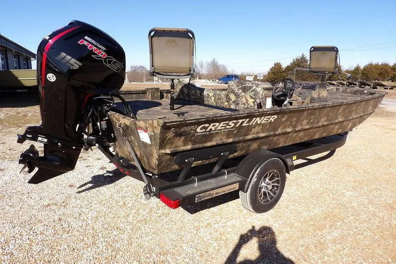 Slide: The Image of 2026 Crestliner 2070 Retriever SCHD boat with camo design and Mercury Pro XS engine. - 6