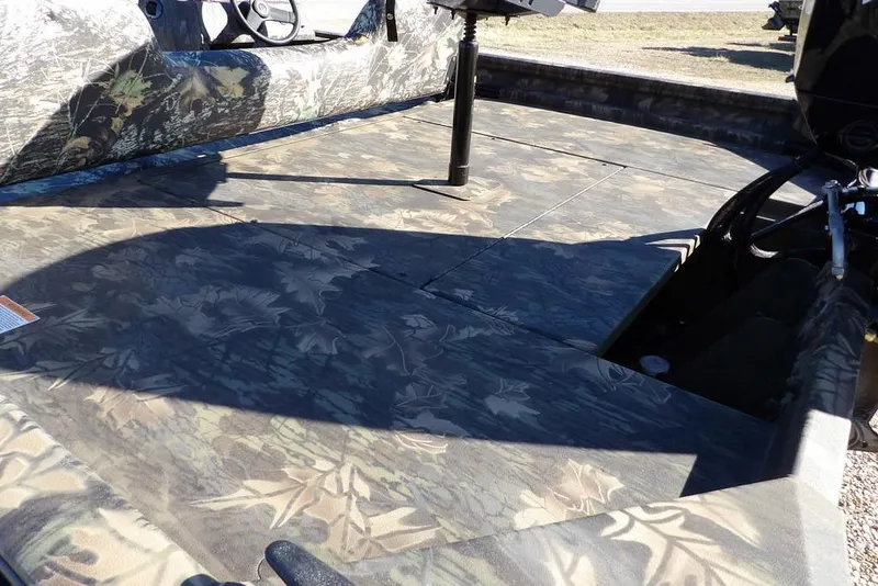 Slide: The Image of 2026 Crestliner 2070 Retriever SCHD boat interior with camouflage design. - 7