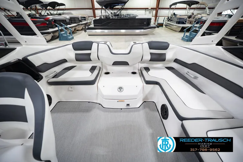 Slide: The Image of Interior of a 2024 Yamaha AR195 boat, white and gray design. - 21