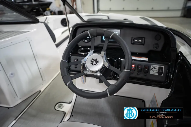 Slide: The Image of 2024 Yamaha Boats AR195 steering wheel and dashboard interior view. - 30