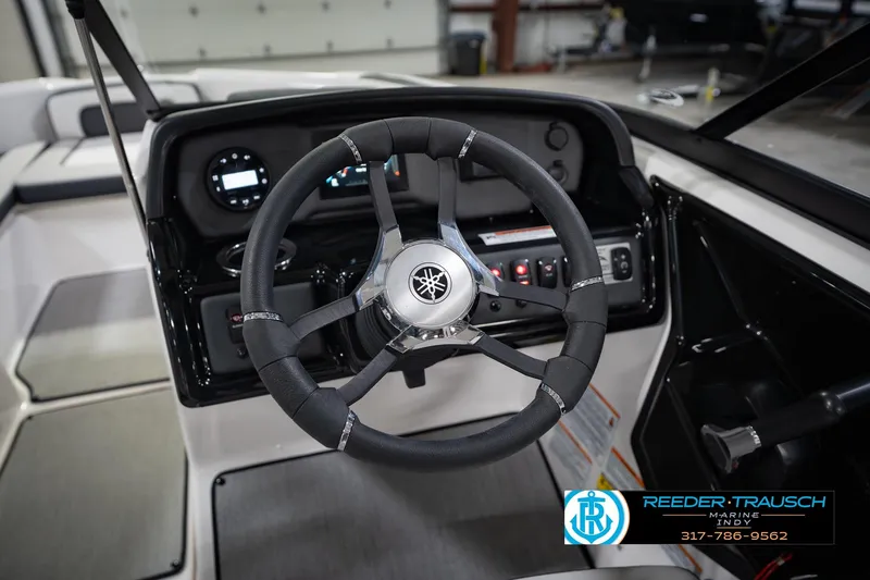 Slide: The Image of 2024 Yamaha AR195 boat steering wheel and dashboard, featuring modern controls and sleek design. - 31