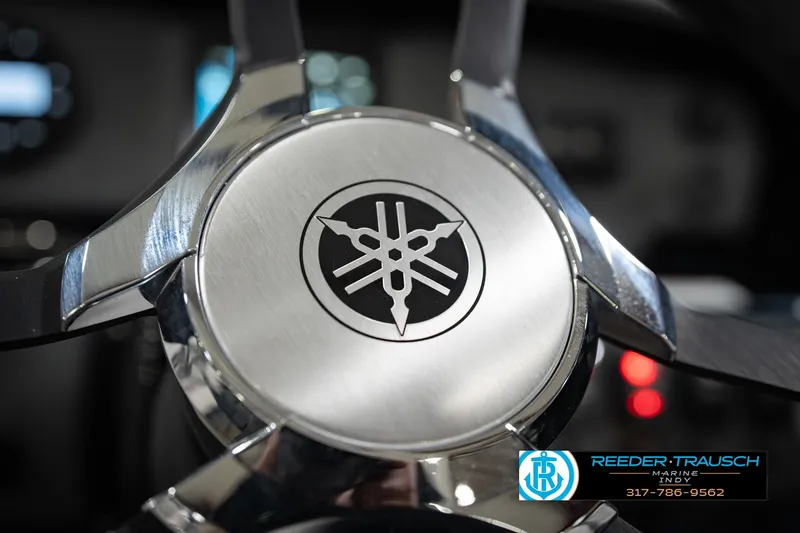 Slide: The Image of Close-up of 2024 Yamaha AR195 steering wheel with logo, showcasing sleek design. - 32