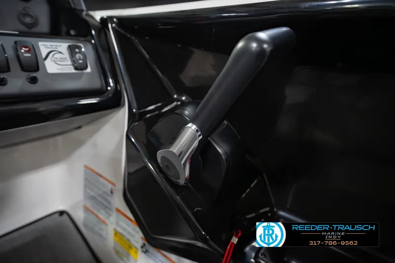 Slide: The Image of 2024 Yamaha Boats AR195 throttle control and dashboard details. - 37