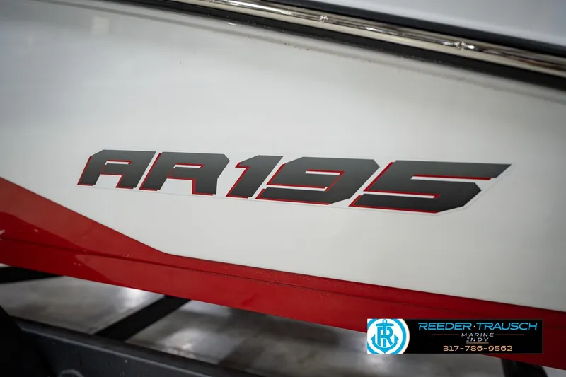 Slide: The Image of 2024 Yamaha Boats AR195 logo on boat hull with red accents. - 50