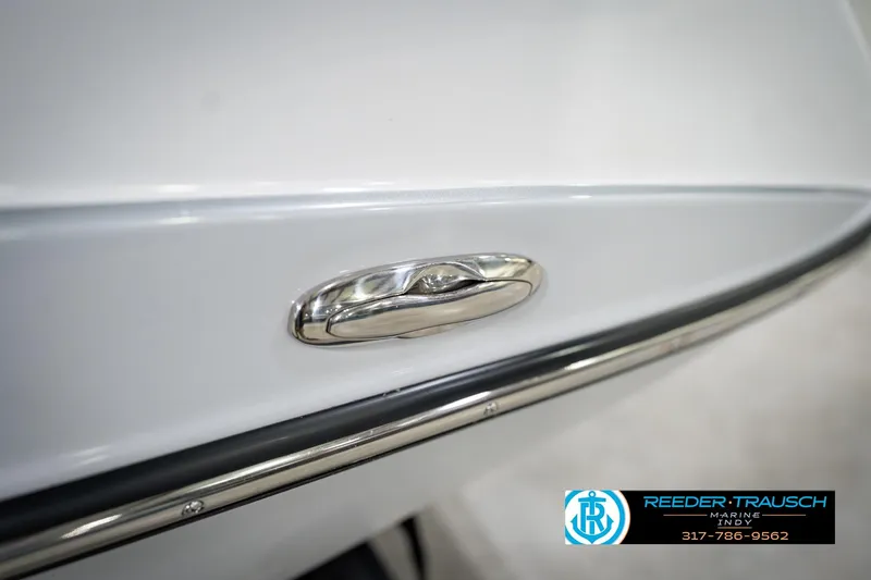 Slide: The Image of 2024 Yamaha Boats AR195 close-up of sleek exterior detail with chrome finish. - 55