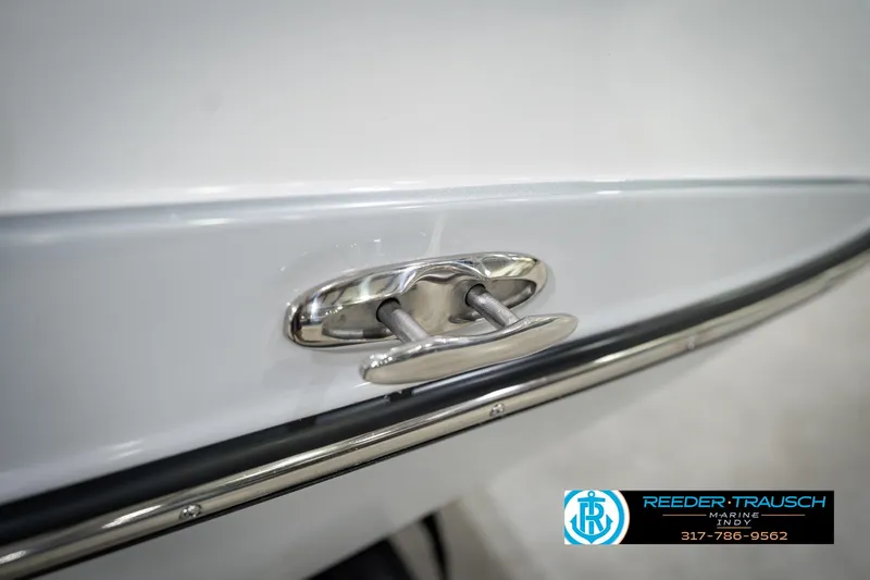 Slide: The Image of 2024 Yamaha AR195 boat cleat detail with Reeder-Trausch Marine logo. - 56