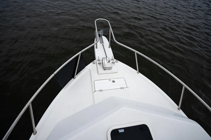 Slide: The Image of Bow view of 2021 Parker 2520 XLD Sport Cabin on water. - 28