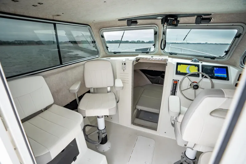 Slide: The Image of 2021 Parker 2520 XLD Sport Cabin interior with modern navigation equipment and seating. - 32