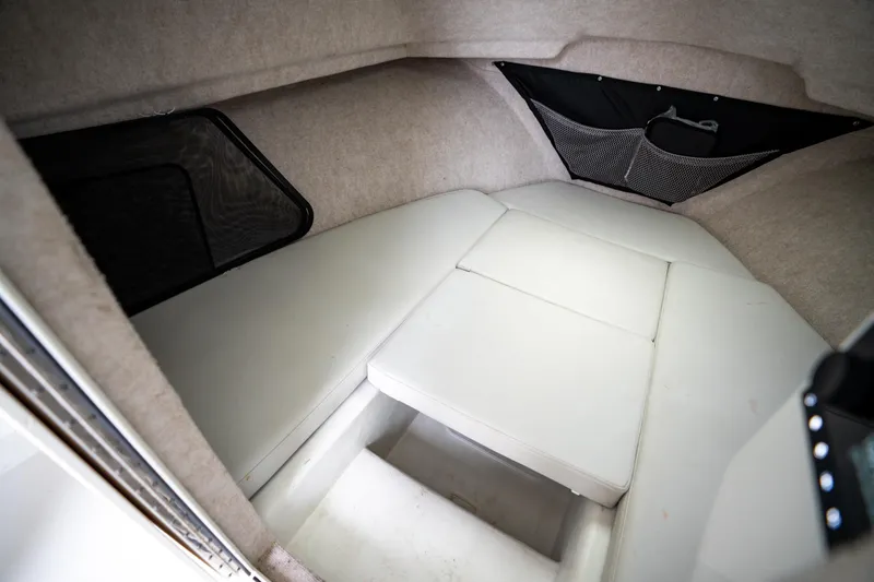 Slide: The Image of 2021 Parker 2520 XLD Sport Cabin interior with cushioned seating and storage. - 35