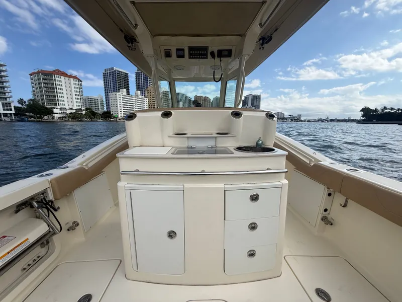 Slide: The Image of Interior view of a 2017 Scout 320 LXF boat with cityscape. - 13