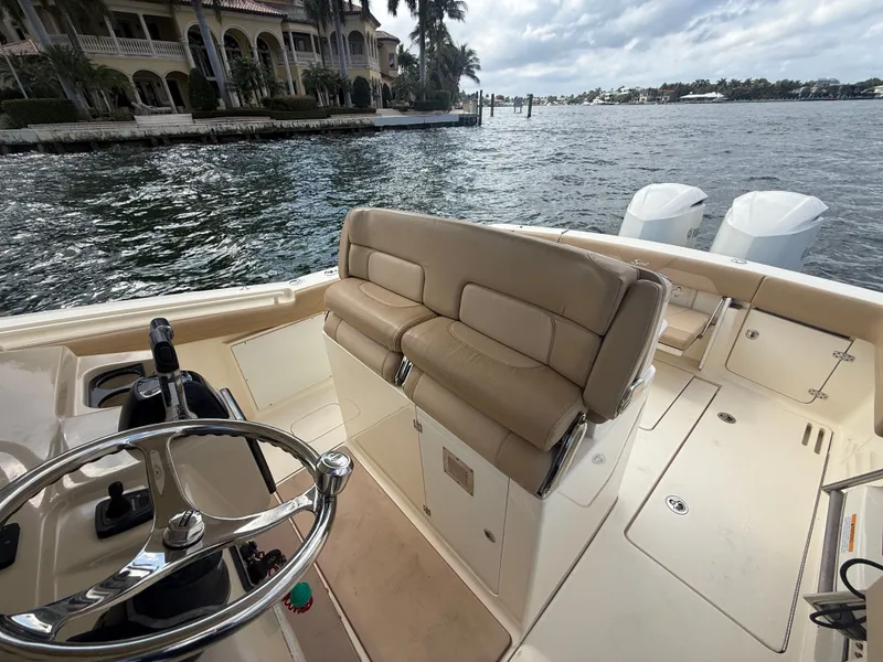 Slide: The Image of Scout 320 LXF 2017 boat with helm and seating area. - 5