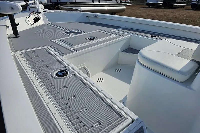 Slide: The Image of 2025 G3 Bay 19 GX boat interior with seating and storage compartments. - 12