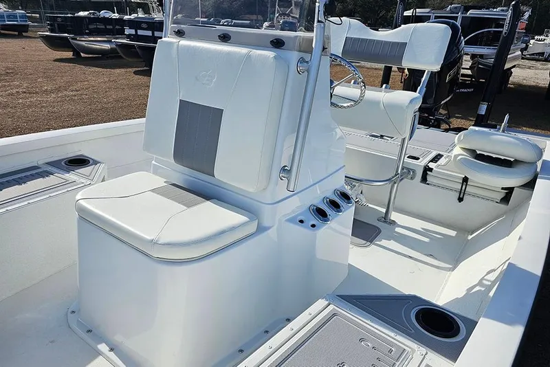 Slide: The Image of 2025 G3 Bay 19 GX boat interior with white seating and steering console. - 14