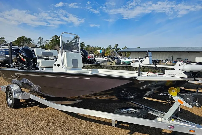 Slide: The Image of 2025 G3 Bay 19 GX boat on trailer, outdoor display, clear sky background. - 3