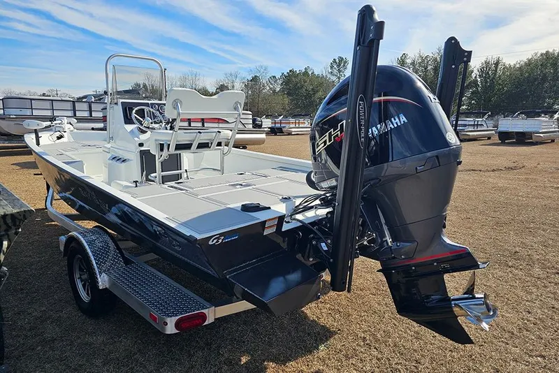Slide: The Image of 2025 G3 Bay 19 GX boat with Yamaha engine on trailer, outdoor display. - 6