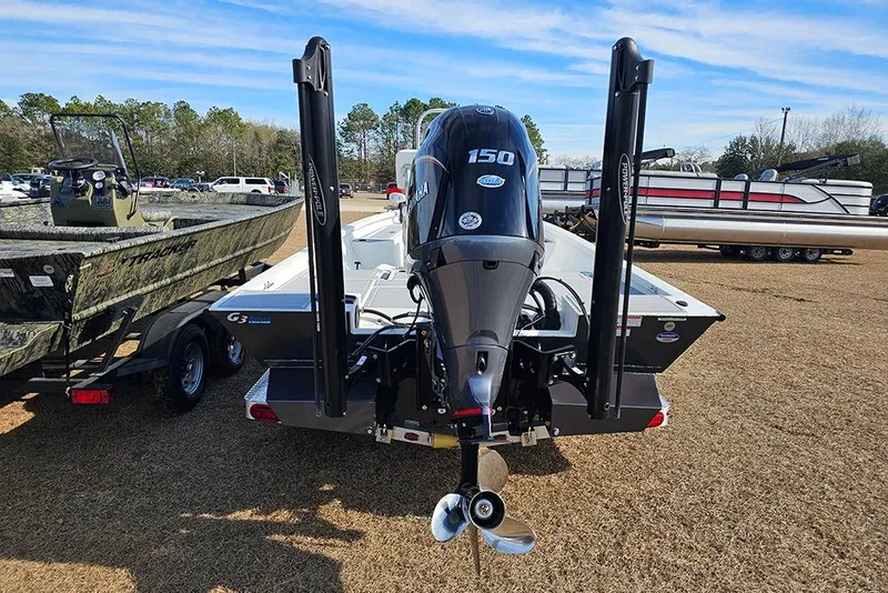 Slide: The Image of 2025 G3 Bay 19 GX boat with Yamaha 150 engine, parked outdoors. - 7