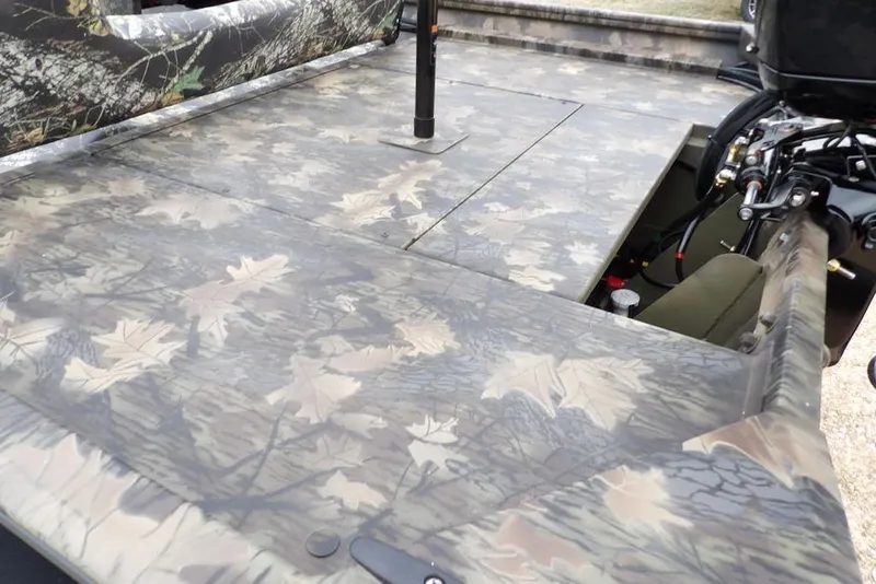 Slide: The Image of 2026 Crestliner 2070 Retriever SCHD boat with camouflage pattern deck. - 11