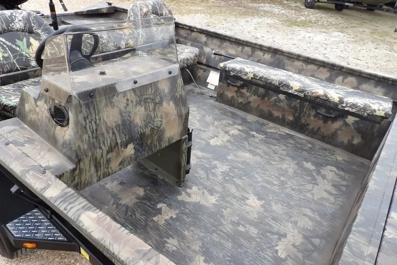 Slide: The Image of 2026 Crestliner 2070 Retriever SCHD boat with camouflage interior and seating. - 13