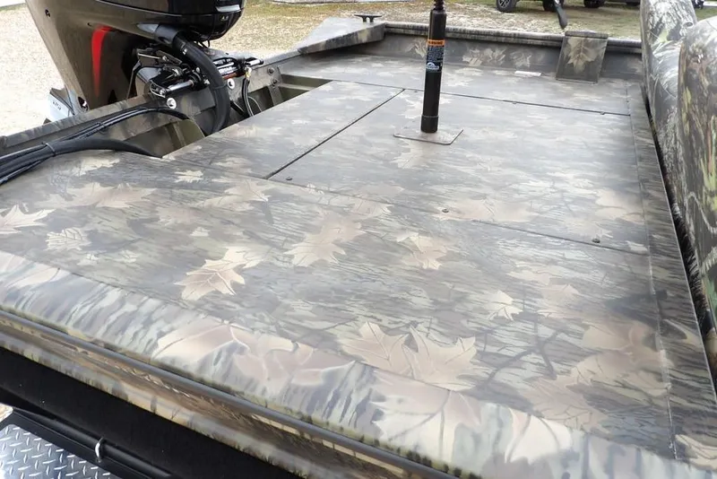 Slide: The Image of 2026 Crestliner 2070 Retriever SCHD boat with camouflage leaf pattern deck. - 14