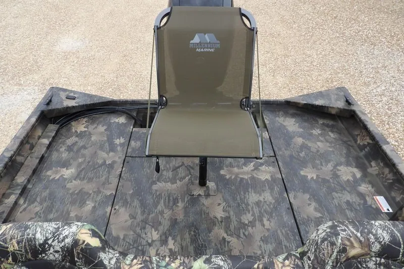 Slide: The Image of 2026 Crestliner 2070 Retriever SCHD boat with camo seating and flooring. - 15