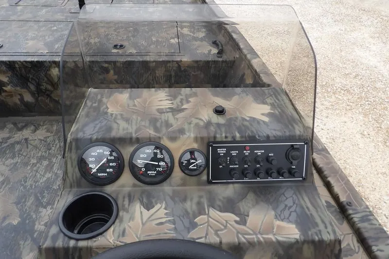Slide: The Image of 2026 Crestliner 2070 Retriever SCHD dashboard with camouflage design and control panel. - 17