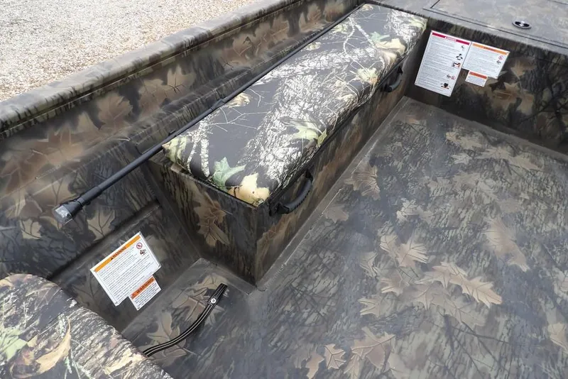 Slide: The Image of 2026 Crestliner 2070 Retriever SCHD boat interior with camouflage seating and flooring. - 19