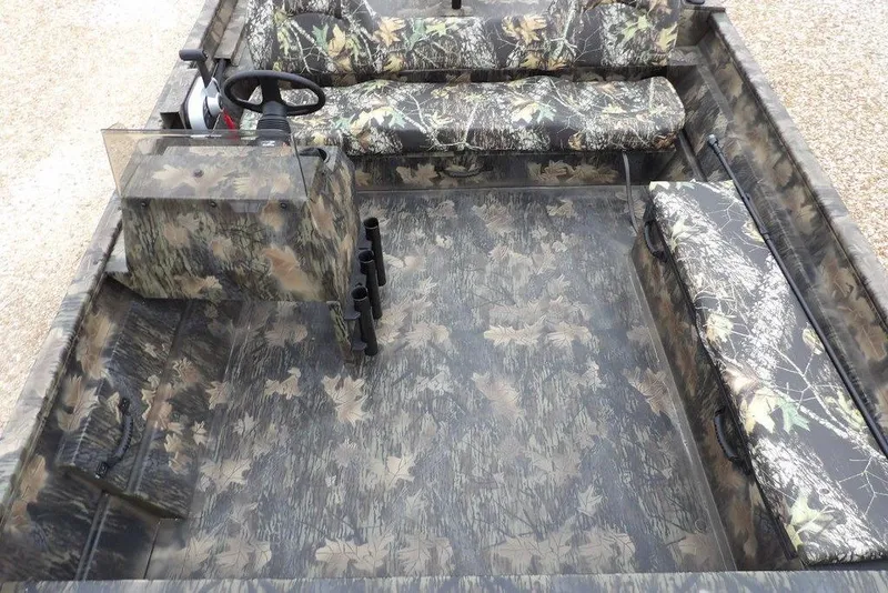 Slide: The Image of 2026 Crestliner 2070 Retriever SCHD boat interior with camouflage seating and flooring. - 21