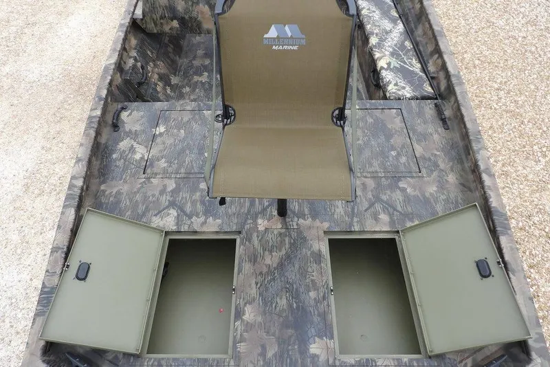 Slide: The Image of 2026 Crestliner 2070 Retriever SCHD boat interior with camo design and storage compartments. - 23