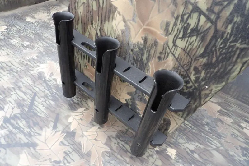 Slide: The Image of Rod holders on a 2026 Crestliner 2070 Retriever SCHD boat with camouflage pattern. - 28