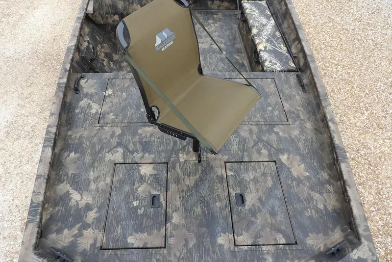 Slide: The Image of 2026 Crestliner 2070 Retriever SCHD boat interior with camouflage design and seating. - 29