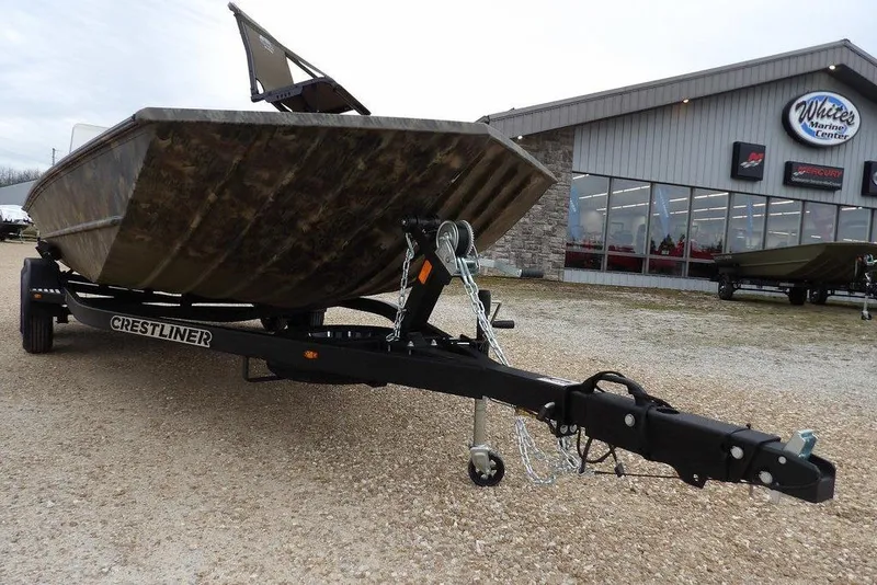 Slide: The Image of 2026 Crestliner 2070 Retriever SCHD boat on trailer outside marine center. - 30