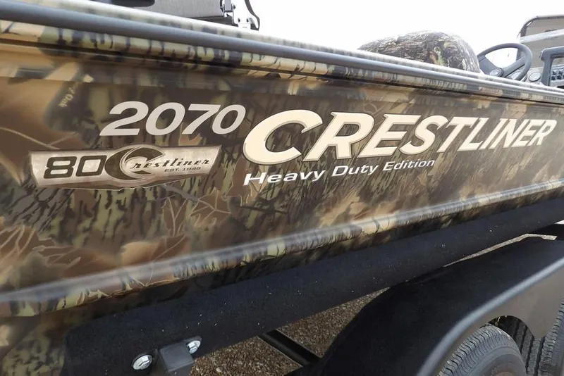 Slide: The Image of 2026 Crestliner 2070 Retriever SCHD Heavy Duty Edition boat with camouflage design. - 38