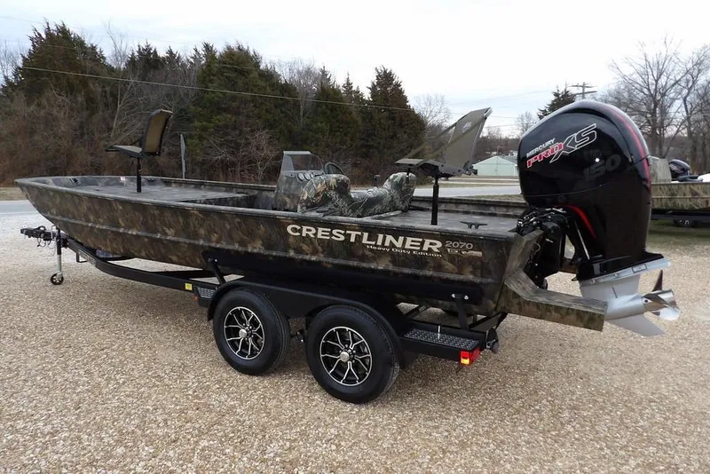 Slide: The Image of 2026 Crestliner 2070 Retriever SCHD boat with camo design and Mercury Pro XS engine. - 7