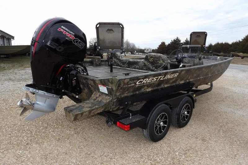 Slide: The Image of 2026 Crestliner 2070 Retriever SCHD boat with Mercury Pro XS engine on a trailer. - 8