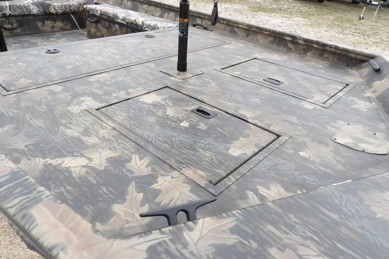 Slide: The Image of 2026 Crestliner 2070 Retriever SCHD boat with camo pattern and storage compartments. - 9