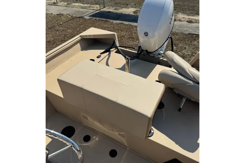 Slide: The Image of 2026 G3 Bay 17 boat interior with beige seating and steering wheel. - 12