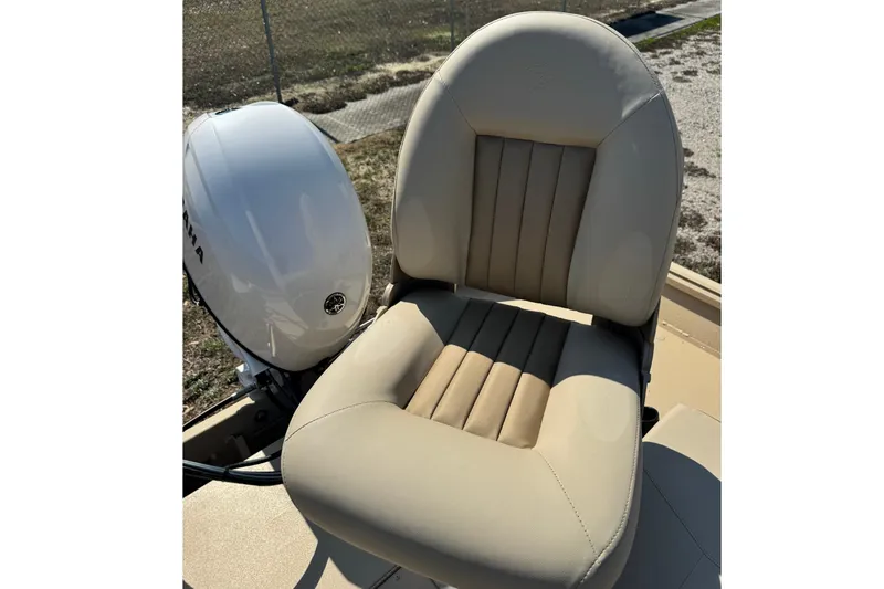 Slide: The Image of Beige seat on 2026 G3 Bay 17 boat with Yamaha engine in background. - 13