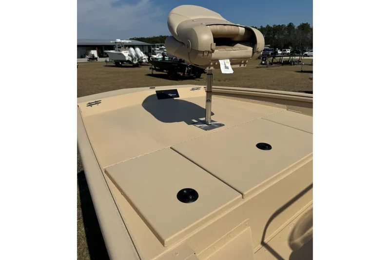 Slide: The Image of 2026 G3 Bay 17 boat deck with beige seating and storage compartments. - 4