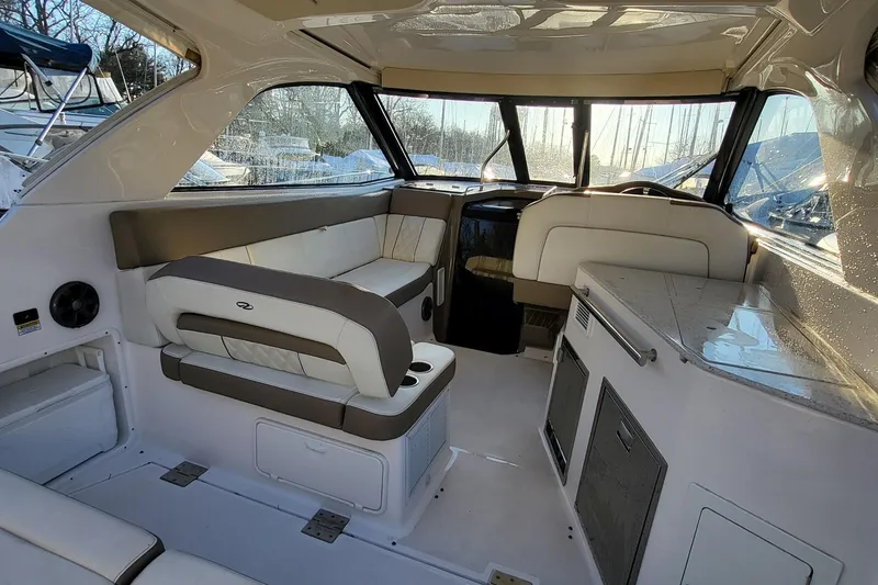 Slide: The Image of 2018 Regal 35 Sport Coupe interior with seating and helm, featuring modern design and amenities. - 21