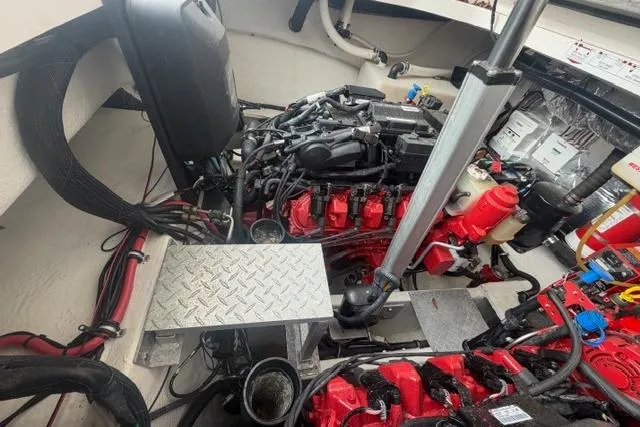 Slide: The Image of Engine room of 2018 Regal 35 Sport Coupe with visible components and wiring. - 33