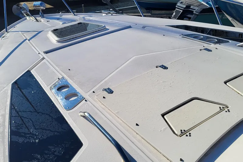Slide: The Image of 2018 Regal 35 Sport Coupe deck with hatches and stainless steel fittings. - 8