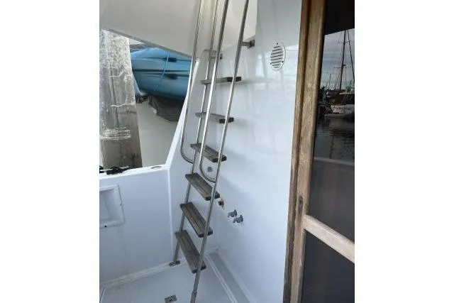 Slide: The Image of Stainless steel ladder on 1988 Kadey Krogen 42 boat, docked near marina. - 17