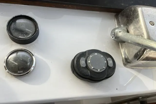 Slide: The Image of Control panel of a 1988 Kadey Krogen 42 boat with gauges and switches. - 24