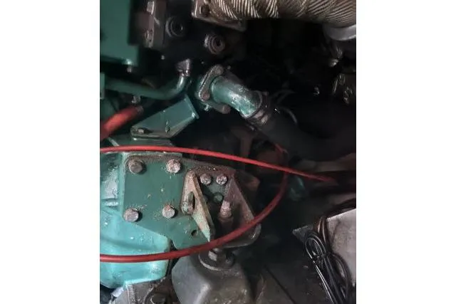 Slide: The Image of Engine components of a 1988 Kadey Krogen 42 boat, featuring visible wiring and hoses. - 34