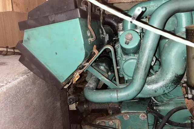 Slide: The Image of Engine compartment of a 1988 Kadey Krogen 42 boat, showcasing mechanical components. - 35