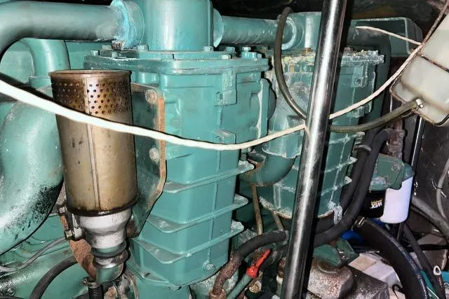 Slide: The Image of Engine compartment of a 1988 Kadey Krogen 42 boat, showcasing mechanical components. - 36