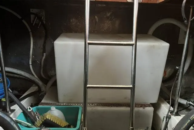 Slide: The Image of Engine room of 1988 Kadey Krogen 42 with ladder and storage container. - 40